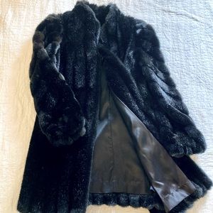 Feaux fur coat, glossy black. Women’s medium. Dry clean only, made in the USA.